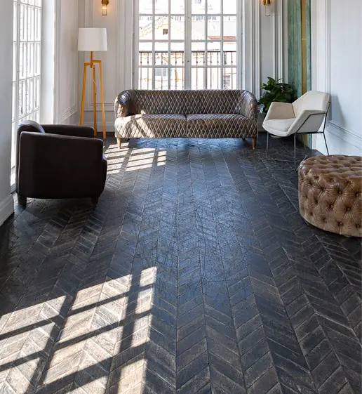 A living room with hardwood floors and furniture.